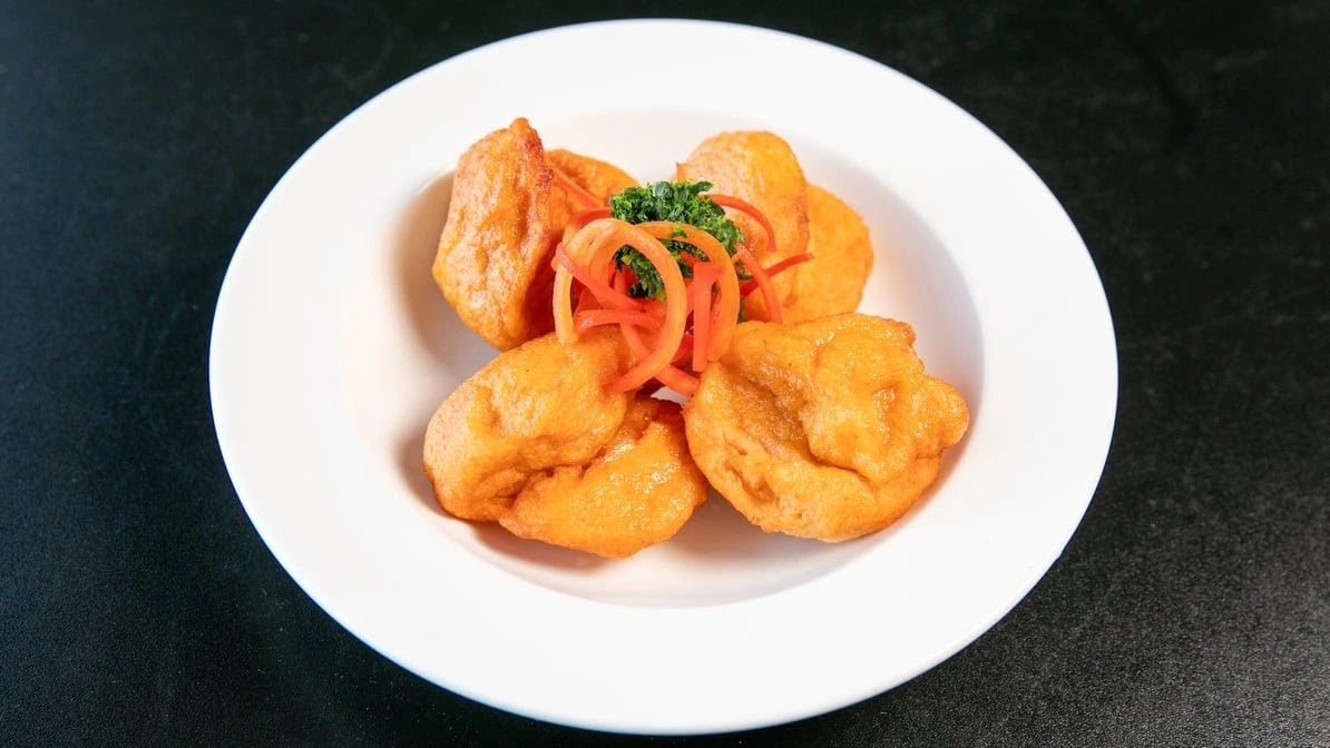 Stewed beef and Nigerian specialties at Global Pot Fusion Cuisine in Winnipeg, MB