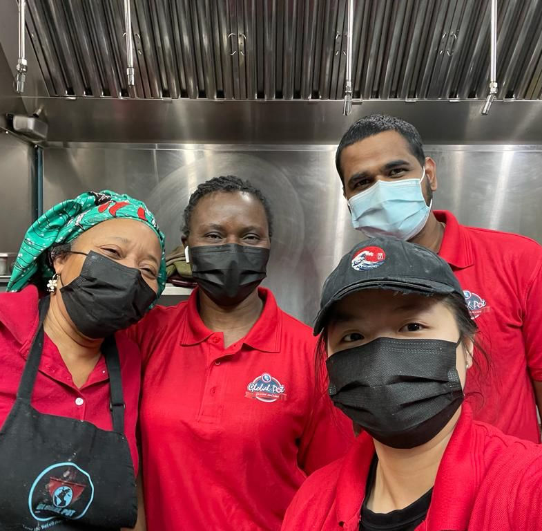 Catering team serving at Winnipeg event - Global Pot service